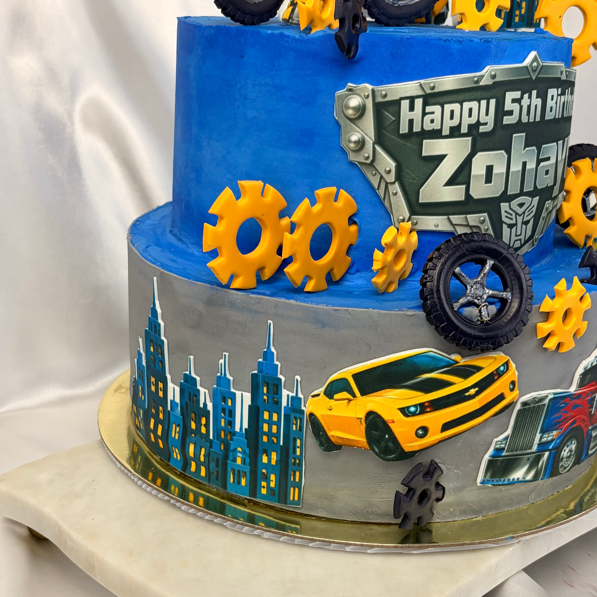 Transformers-Themed Two-Tier Birthday Cake with Custom Name Plaque