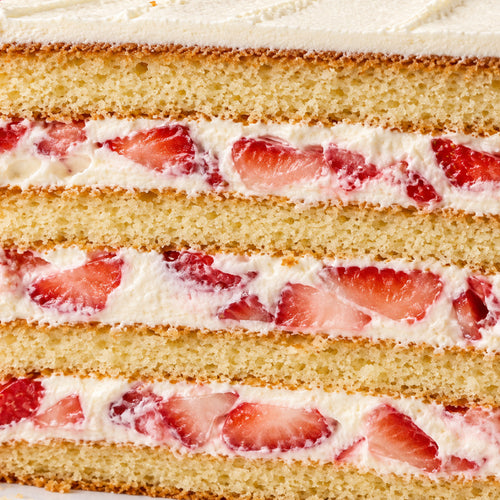 Slice of vanilla cake with fresh strawberry